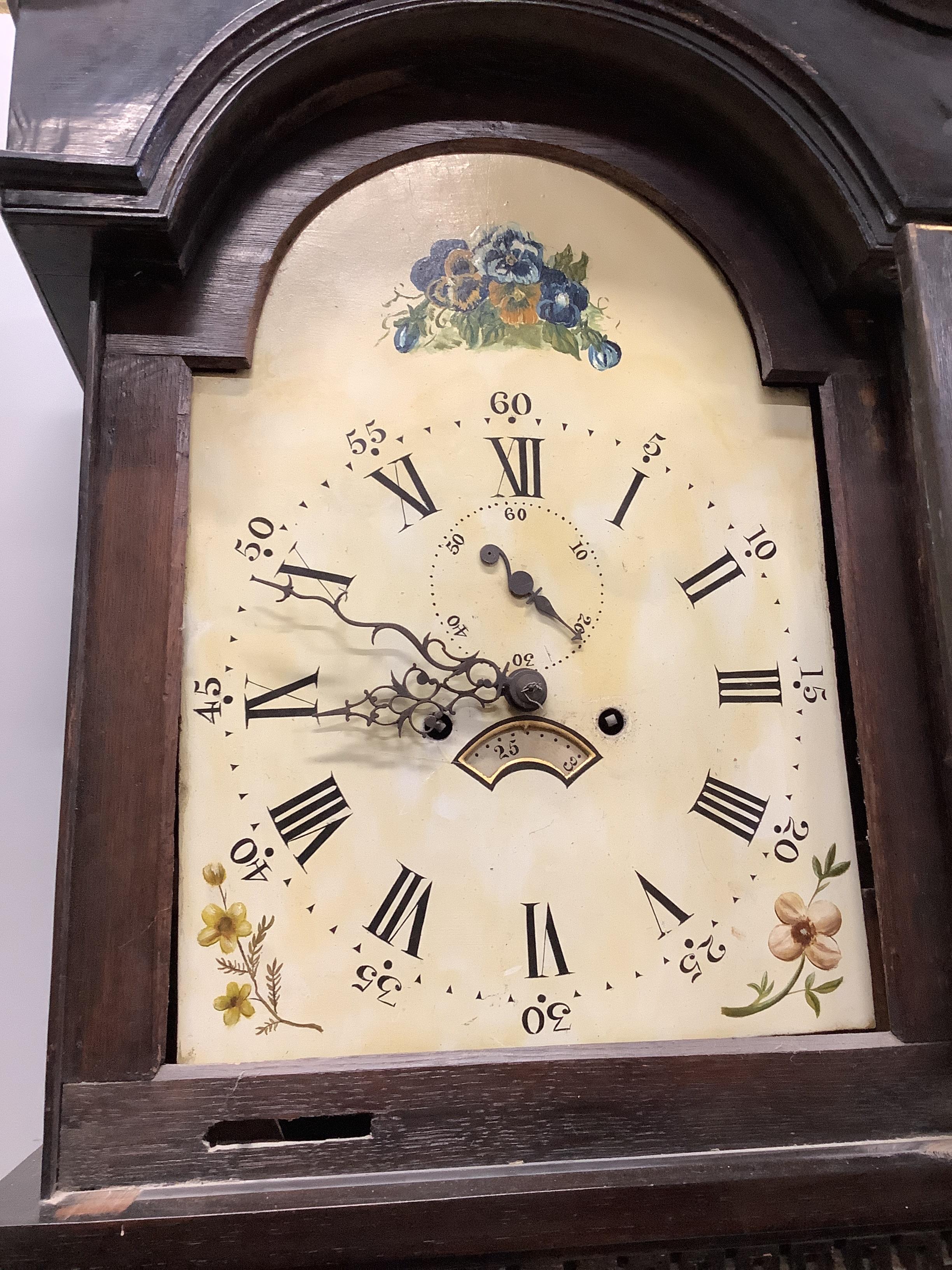 An early 19th century oak eight day longcase clock with arched painted dial, height 227cm